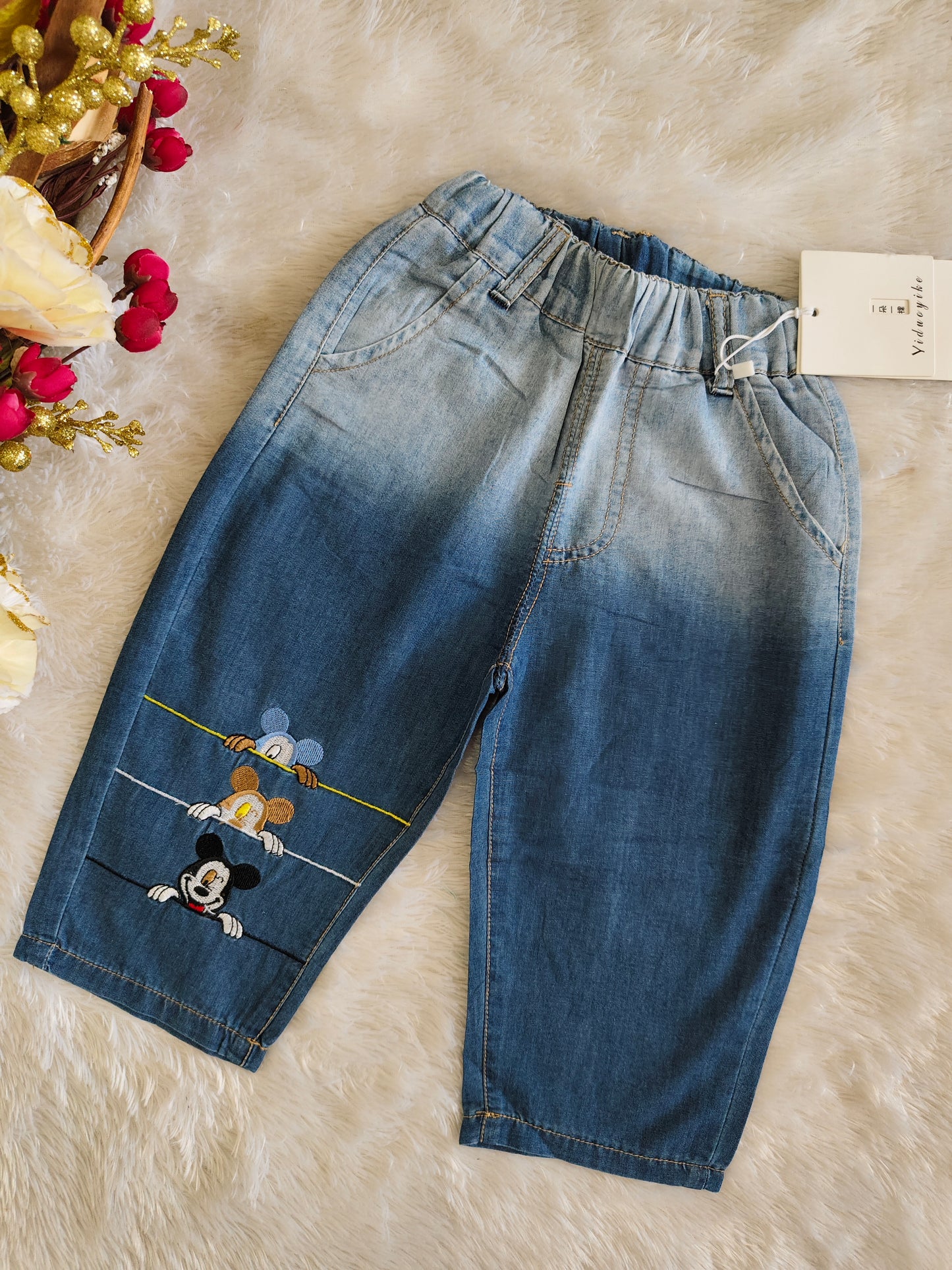 Pants with mickey design at bottom