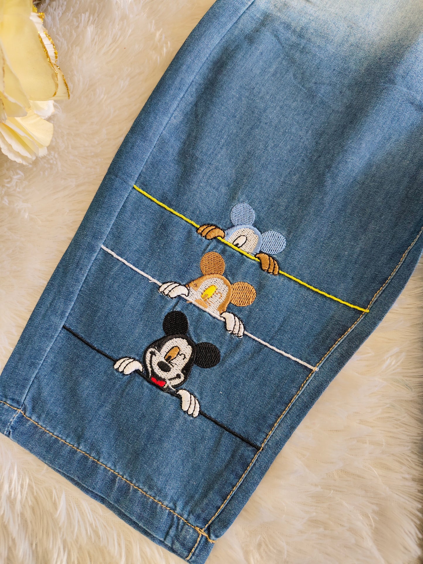 Pants with mickey design at bottom